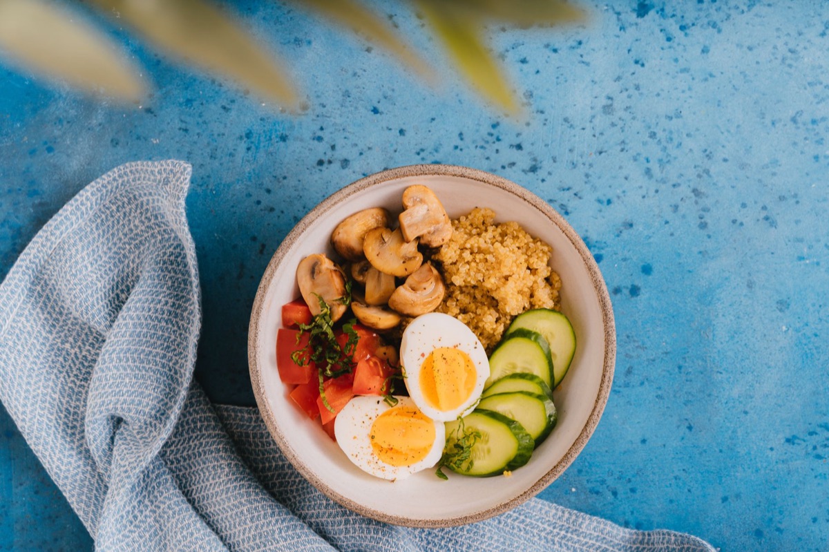 A colorful bowl of fresh vegetables and grains representing physical wellness.