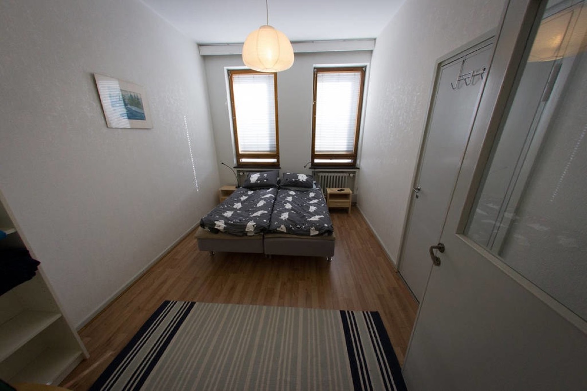 Blackout curtains in a quiet bedroom creating a dark, restful environment
