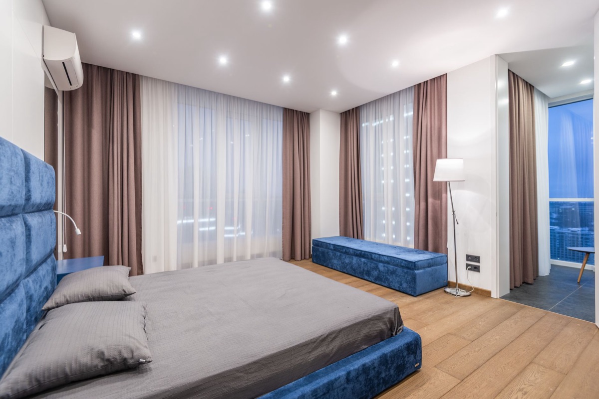 camera-ready minimalist bedroom with blackout curtains