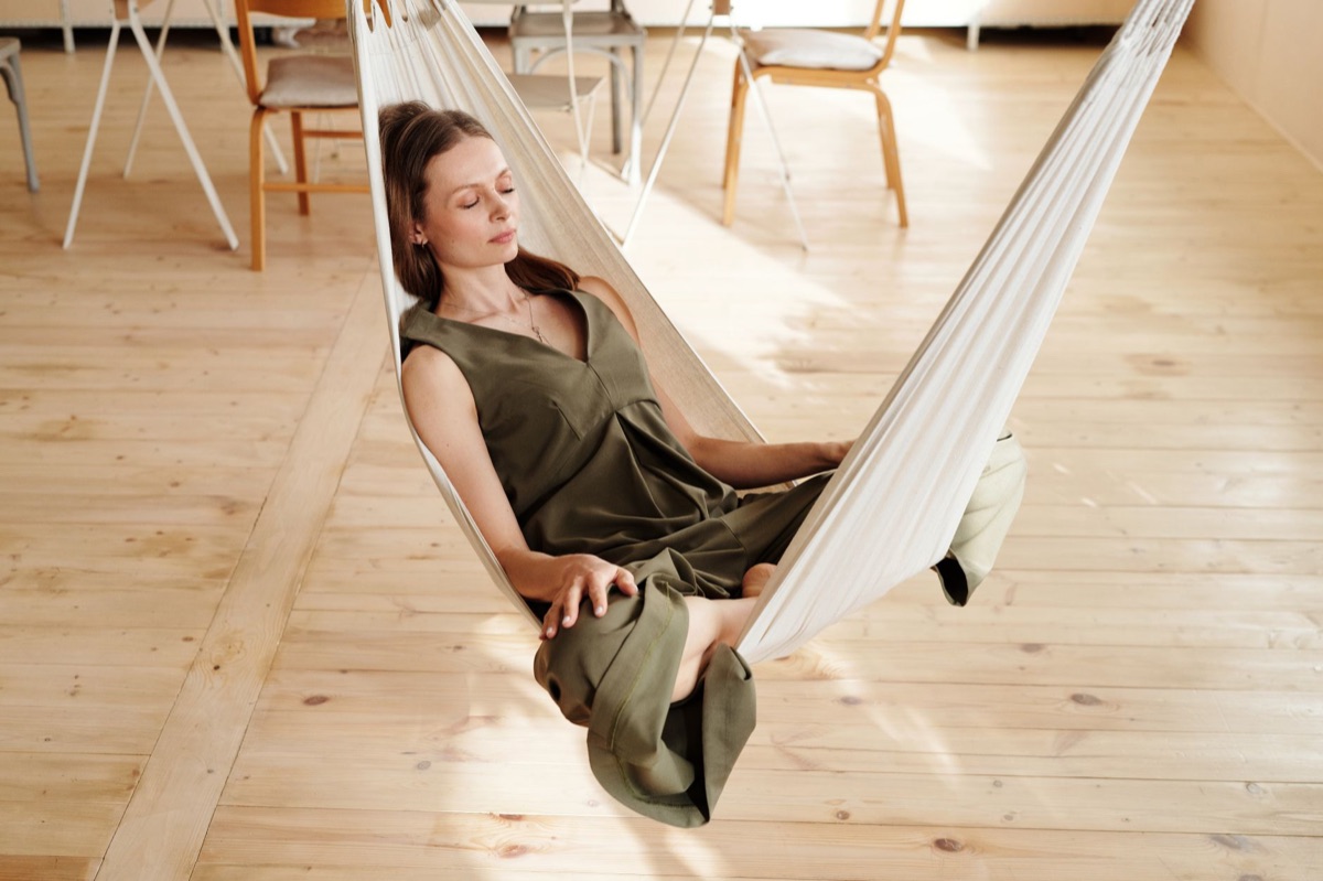 person with closed eyes in a quiet room